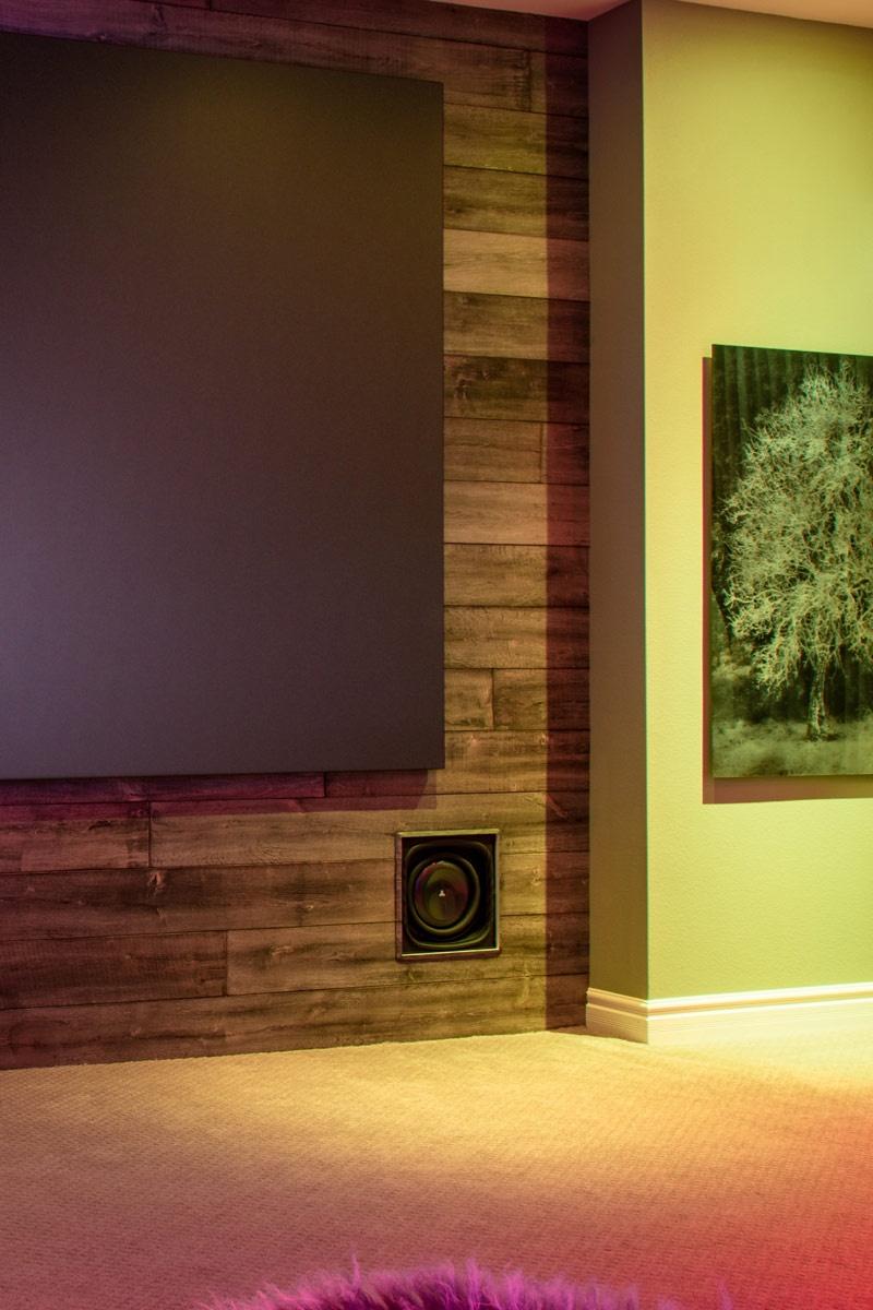 big screen displaying the av specialist logo on a home theater