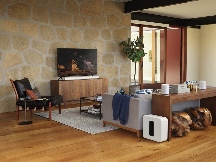 A fancy living room with Sonos speakers.