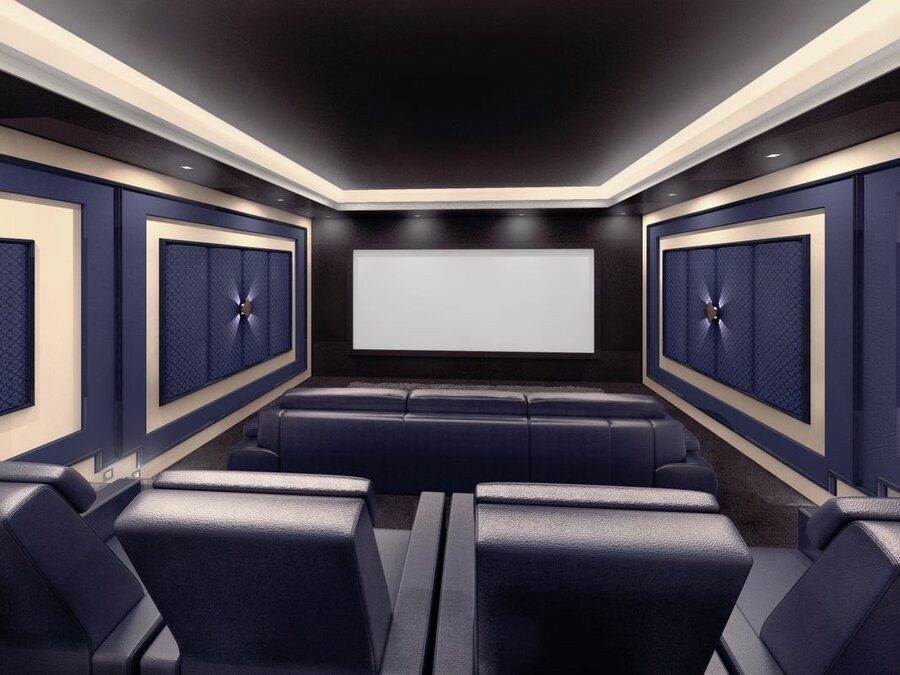 A professional home theater design and setup featuring comfy seating, acoustic paneling, and a large screen display.
