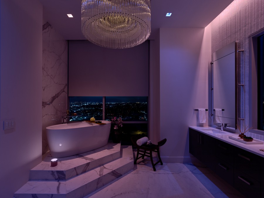 A bathroom illuminated by Lutron smart lighting.