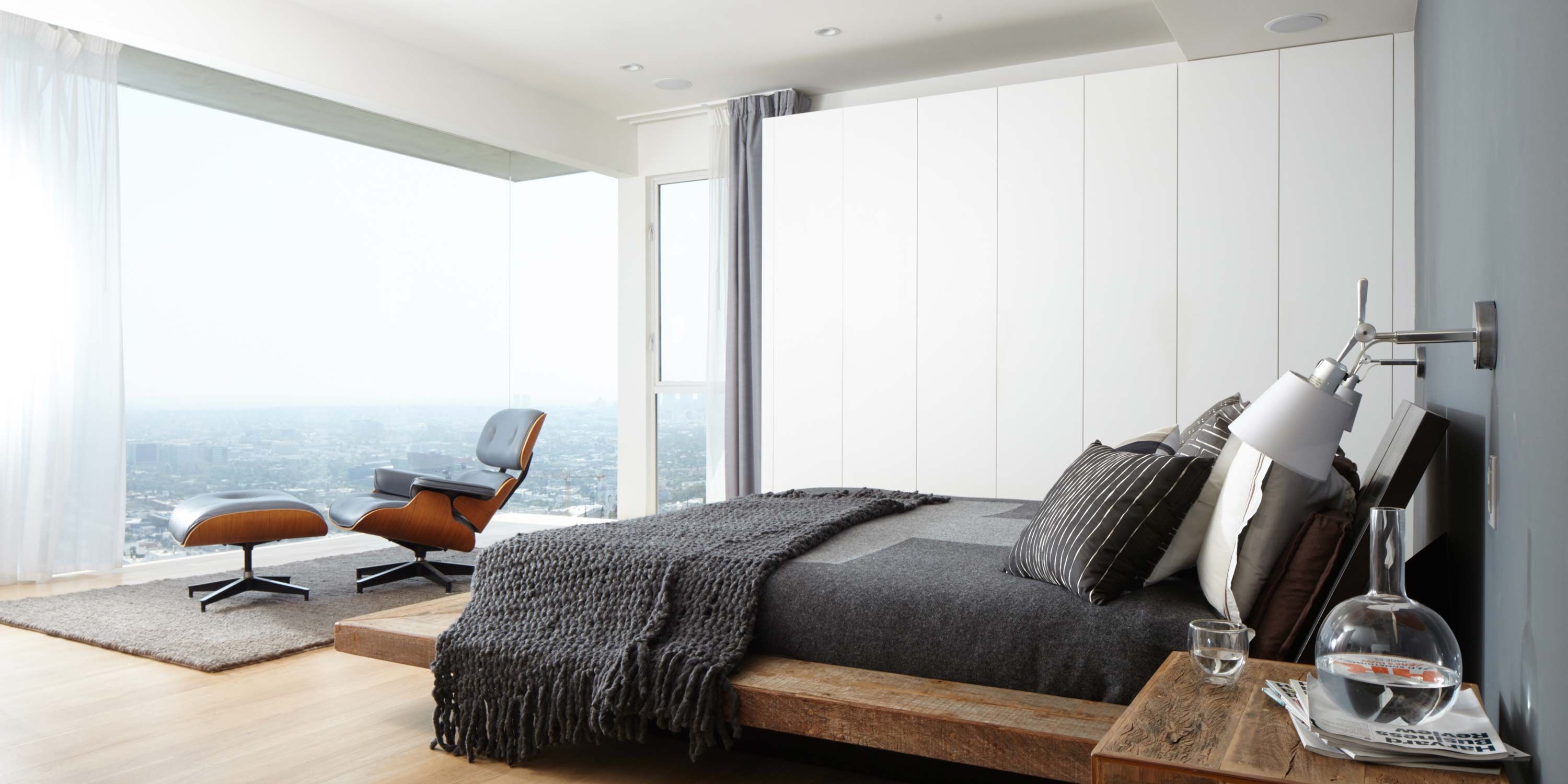 bedroom with a view of the rolling hills and modern furniture and neutral colors