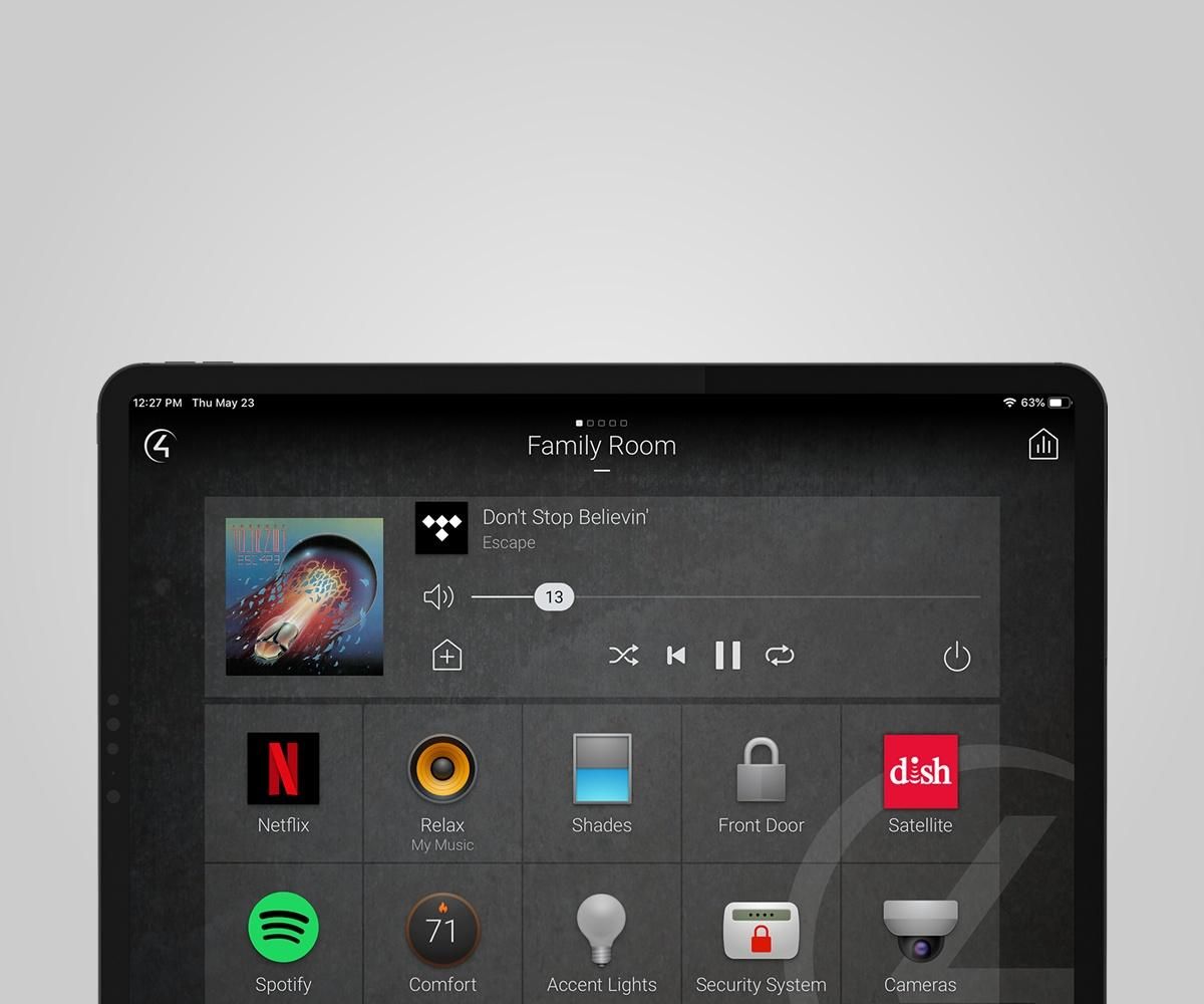 Control4 red controller on top of a couch